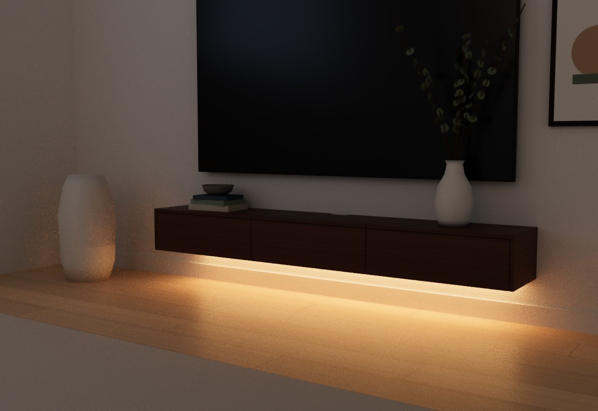 Floating TV console at night with the warm under-cabinet LED strip lighting the wall and floor